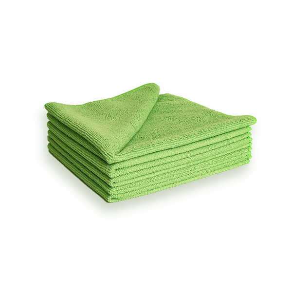 A stack of green microfibre cleaning cloths on a white background