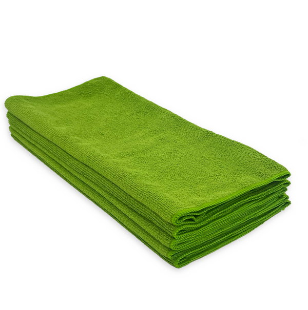A stack of green microfibre cloths on a white background