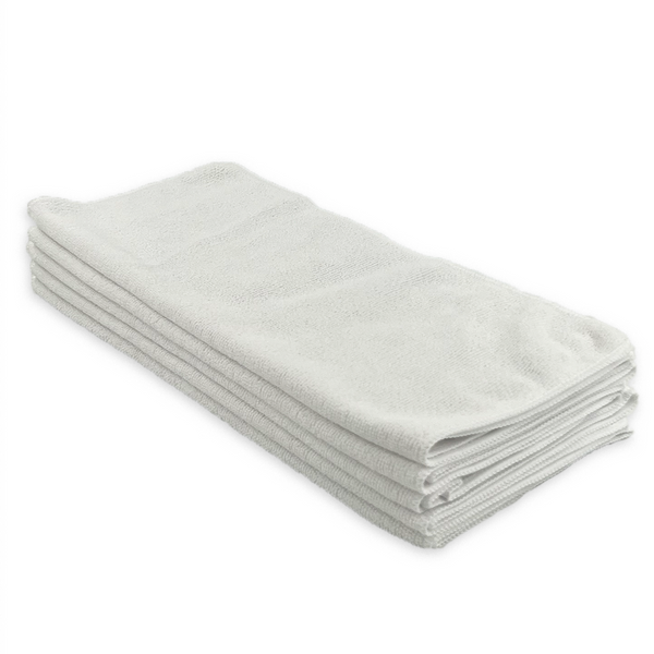 A stack of white microfibre cloths on a white background
