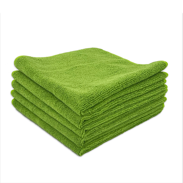A stack of green microfibre cloths neatly folded on a white background