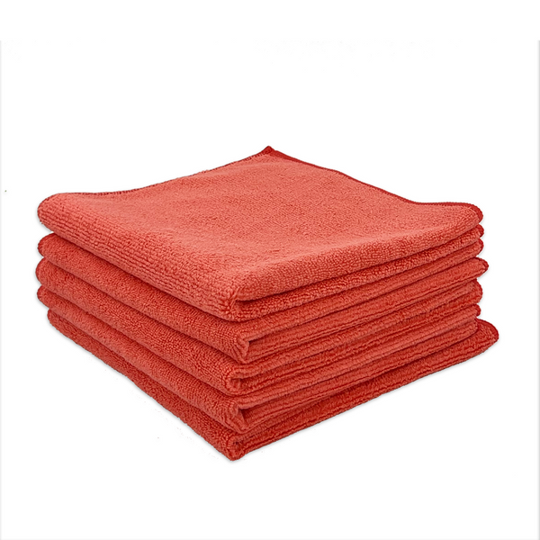 A stack of red microfibre cloths neatly folded on a white background