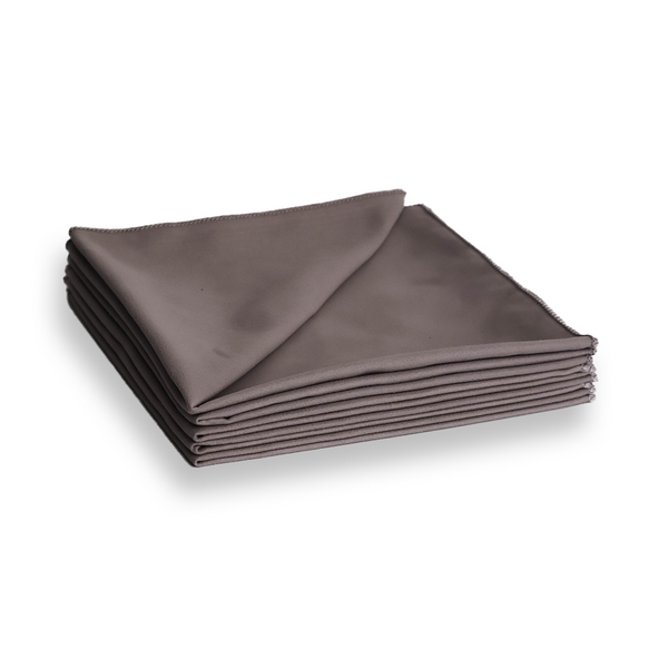 folded grey suede microfibre cloth on a white background