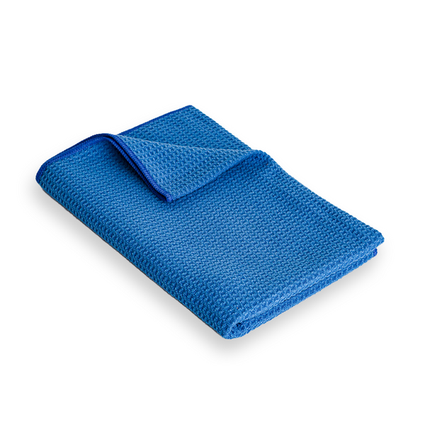 A large dark blue woven microfibre cloth with a waffle texture.