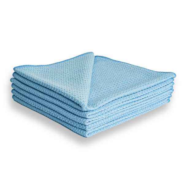 A stack of blue waffle weave microfibre cloths.