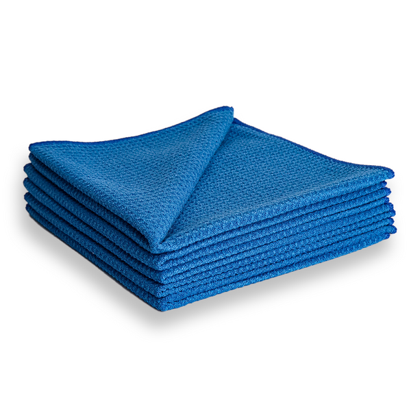 A stack of dark blue waffle weave microfibre cloths.