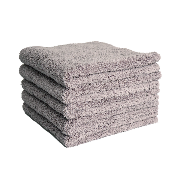 a stack of plush grey microfibre cloths