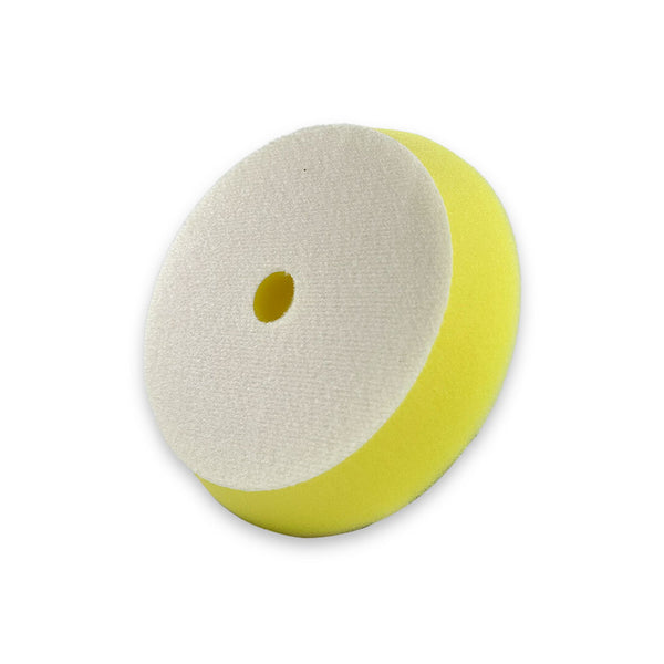 A yellow beveled edge buffing pad made from US foam, designed for dual action buffing and suitable for use with a velcro backing plate.