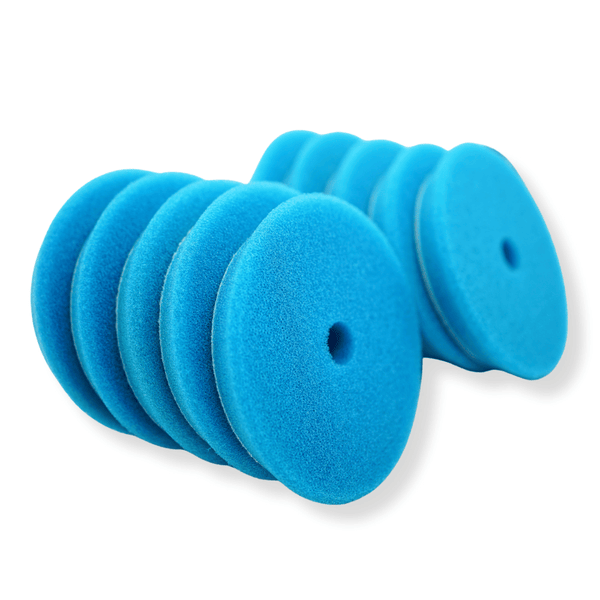 A stack of blue 5inch buffing pads on a white background
