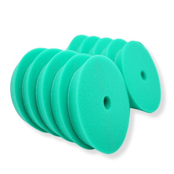 A stack of green 5inch buffing pads on a white background