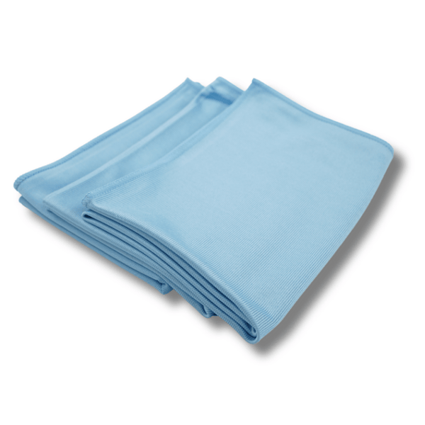 Folded blue glass cloth on a white background