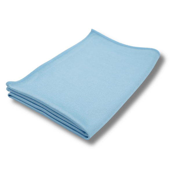 Folded blue glass cloth on a white background