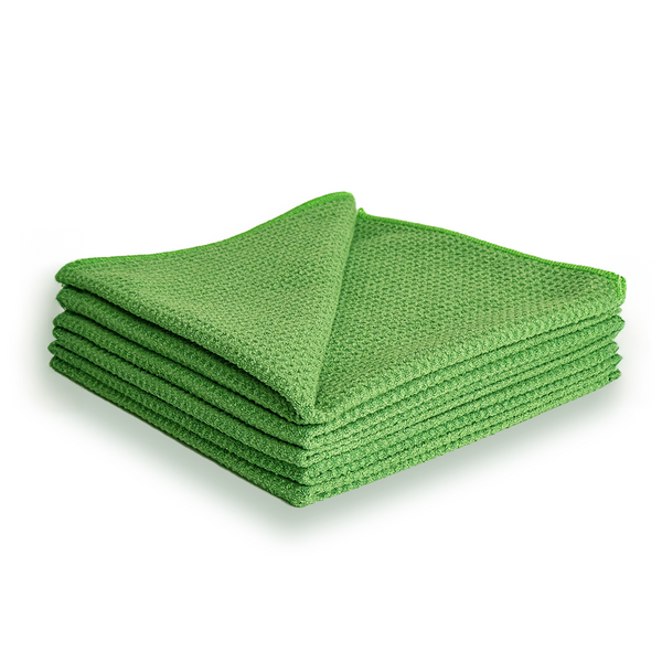 A stack of green waffle weave microfibre cloths.