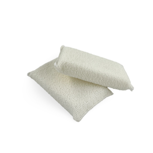 Two white microfiber interior protection applicators designed for a streak-free finish on various surfaces.