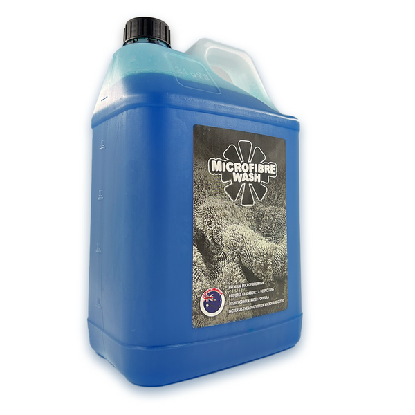 A bottle of Microfibre Wash detergent with a label showing a close-up image of a microfibre cloth.