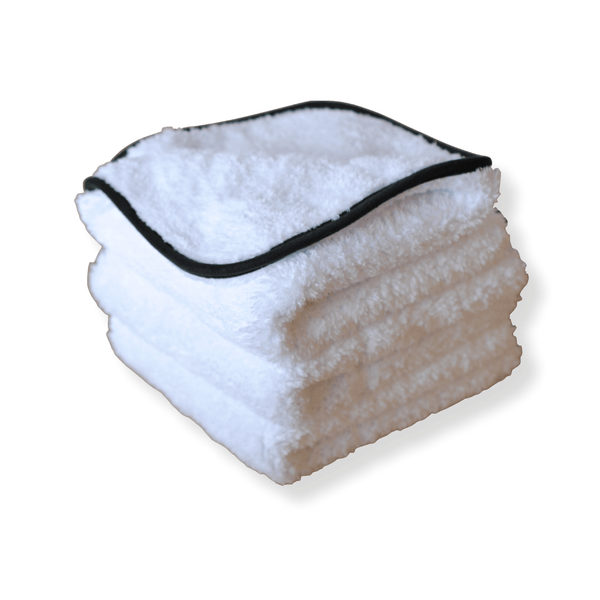 A stack of plush White microfiber cloth on a white background