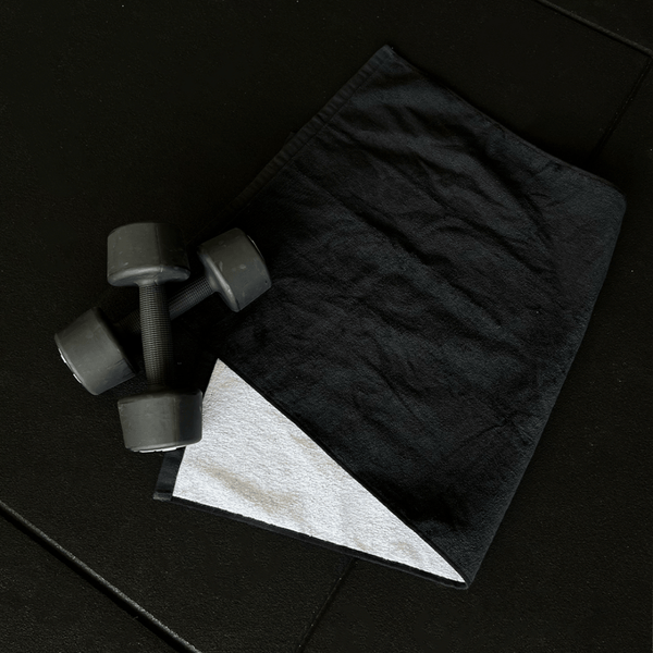 Swat Towel on a gym floor with Weights