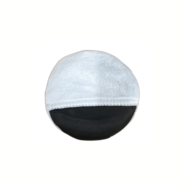 A round microfibre coating applicator with a black base and white microfibre covering, featuring internal seams and a finger slot.