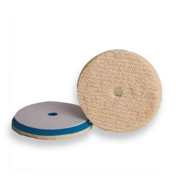 Dual-sided wool buffing pad with a tan colour on the surface and a blue backing foam visible in one side.
