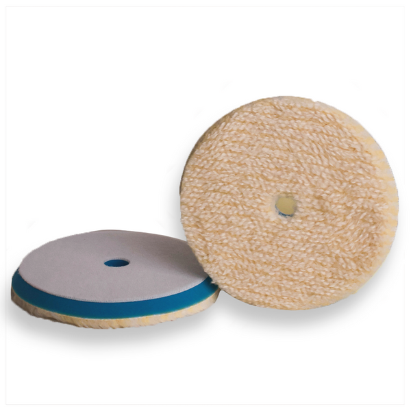 Dual-sided wool buffing pad with a tan colour on the surface and a blue backing foam visible in one side.