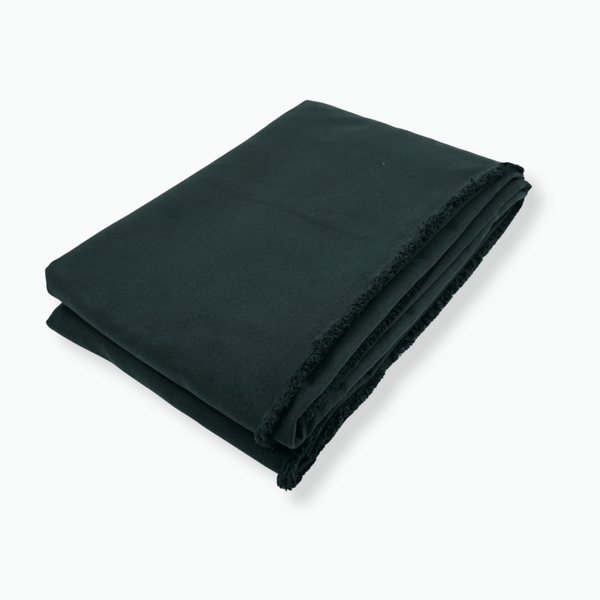 Folded black microfibre on a white background