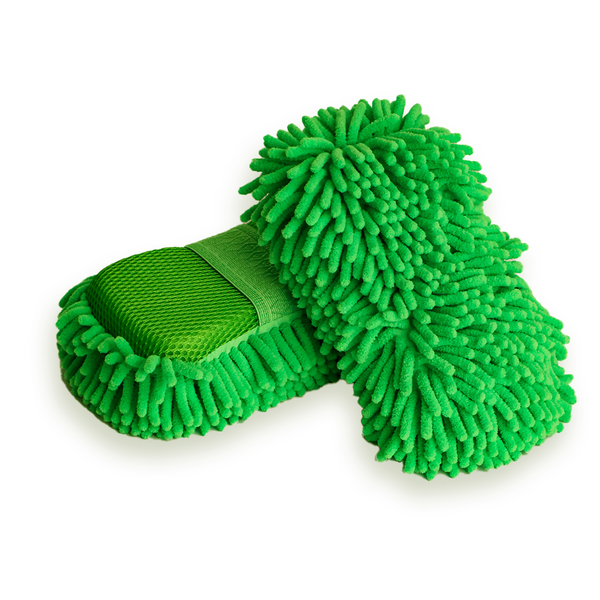 A green noodle sponge on a white background