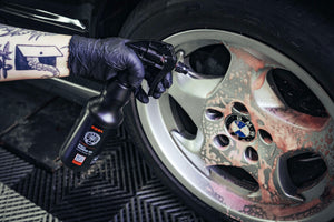 Gloved Hand Spraying ADBL Wheel Warrior Gel on BMW Wheel - Acidic Wheel Cleaner Action Shot with Foaming Effect
