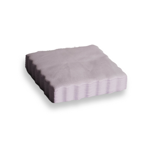 A stack of white suede cloths on a white background