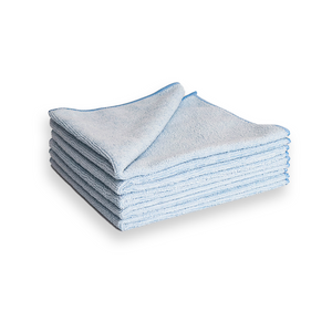 A stack of light blue microfibre cleaning cloths on a white background