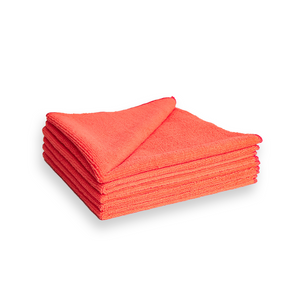 A stack of red microfibre cleaning cloths on a white background