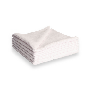A stack of white microfibre cleaning cloths on a white background