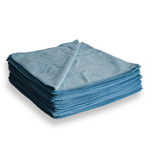 Stack of blue microfibre cloths on a white background