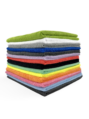 A large stack of multicoloured microfibre cleaning cloths on a white background