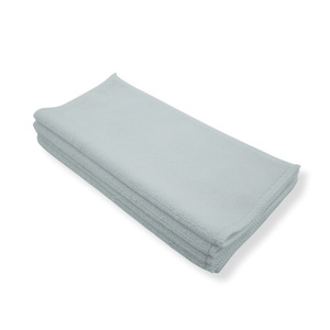 Folded white micofibre cloths on a white background
