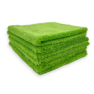 A stack of green 310 gsm microfibre cloths 
