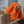 A orange microfibre cloth on a kitchen tap