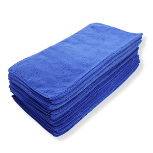 A stack of dark blue microfibre cloths on a white background
