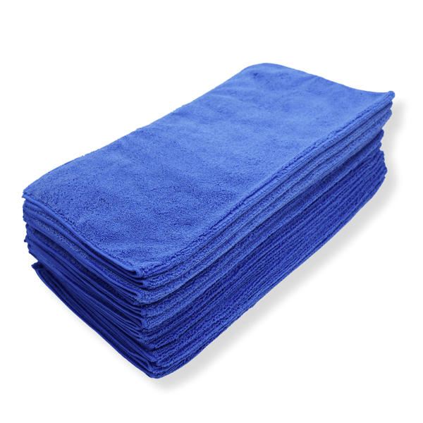 A stack of dark blue microfibre cloths on a white background