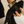 Person holding a silver container with a black towel labeled 'Barista Cloth' against a neutral background


