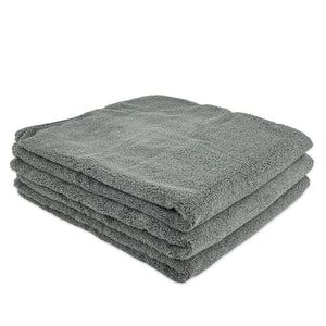 A stack of grey microfibre bath towels 