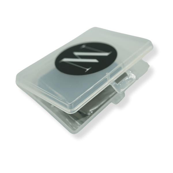 Clear plastic container with grey items inside on a white background