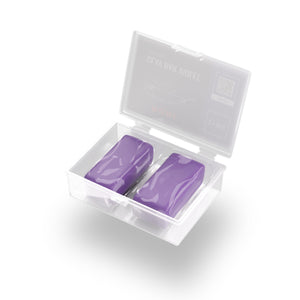 A box with two purple clay bars on a white background