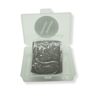 Clear plastic container with heavy grade clay bar inside on a white background