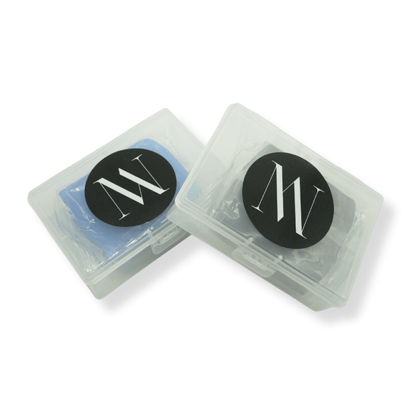 Two clear containers with fine and medium clay bars on a white background