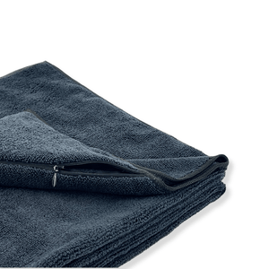 Folded black gym towel with a zip pocket on a white background 