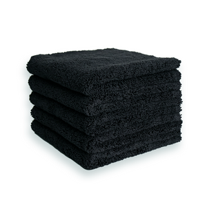 A stack of plush black microfibre cloths