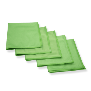 A stack of green glass cloths on a white background