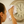 Person cleaning a vintage clock with a microfibre glass cloth