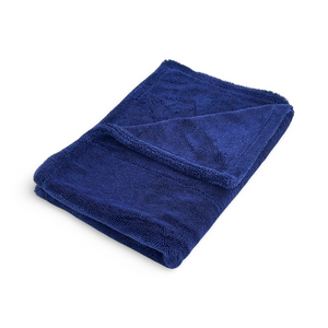 A folded royal blue microfibre towel on a white background.