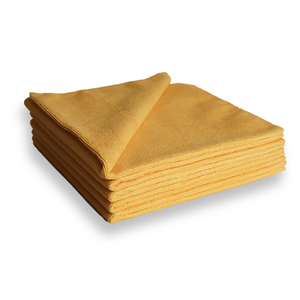 A stack of orange microfibre cloths on a white background