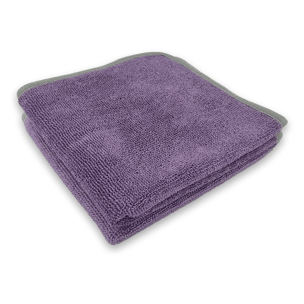 Purple microfibre towel with grey border on a white background